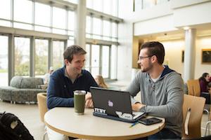 Students talking at table